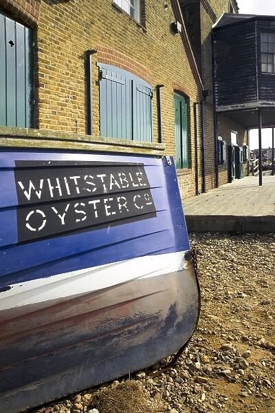 Oyster boat outside the oyster stores on the seafront, Whitstable, Kent