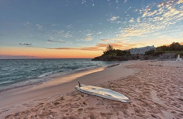 Paddleboard on the beach at sunset, Bermuda South Shore, Bermuda, North Atlantic, North America