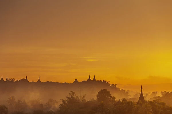 Pagoda spires at sunset, Mrauk U, Rakhine State, Myanmar (Burma), Asia