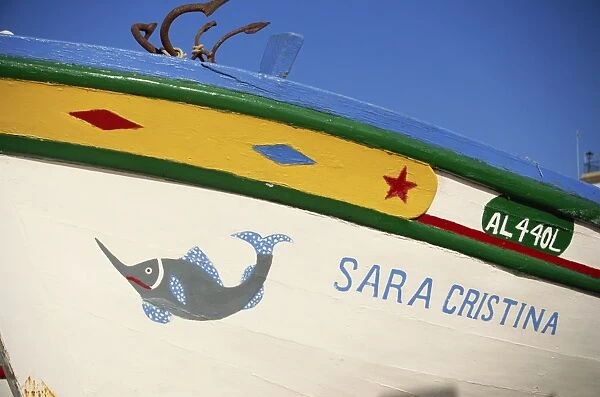 Detail of painted side of a fishing boat in the Algarve