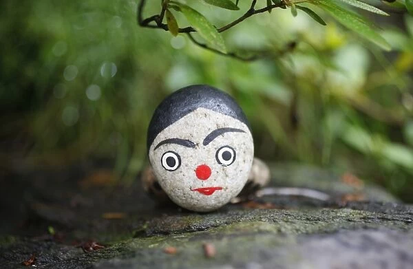 Painted stone used in shamanist rituals, Seoul, South Korea, Asia