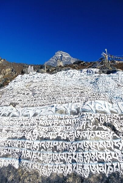 Painted Sutras (Mahayana Buddhist scriptures) on a rock