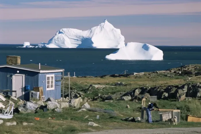 Framed Print : Painted wooden fishermans house in front of icebergs in Disko Bay Framed Print : Painted wooden fishermans house in front of icebergs in Disko Bay