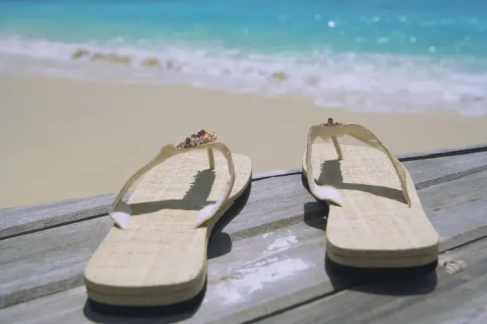 Framed Print : Pair of slippers on deck on beach Framed Print : Pair of slippers on deck on beach