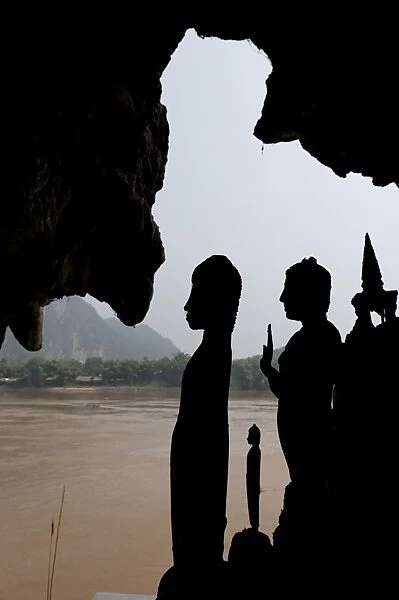 The Pak Ou caves, a well known Buddhist site and place of pilgrimage, 25km from Luang Prabang