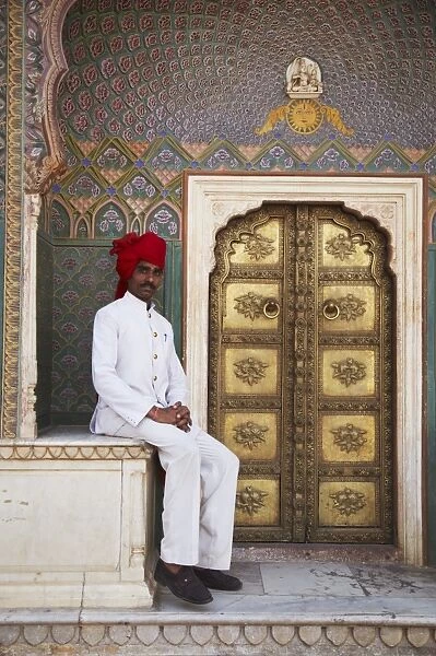 Palace guard sitting at Rose Gate in Pitam Niwas Chowk, City Palace, Jaipur