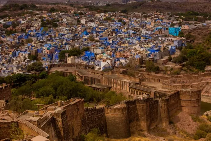 Framed Print : The palace walls of Mehrangarh Fort towering over the blue rooftops in Jodhpur, the Blue City Framed Print : The palace walls of Mehrangarh Fort towering over the blue rooftops in Jodhpur, the Blue City