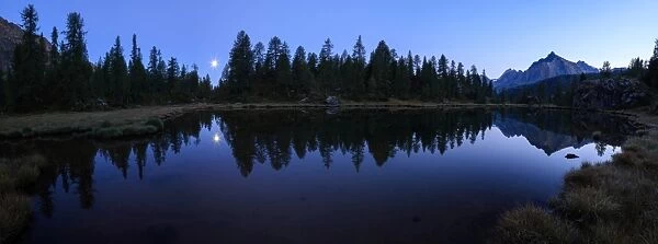 Panorama of the blue Lake Mufule lit by the moon, Malenco Valley, Province of Sondrio
