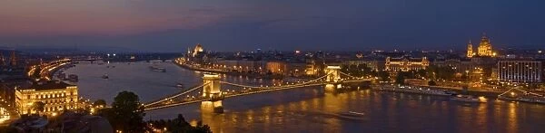 Panorama of the city at dusk with the Hungarian Parliament building and the Chain bridge