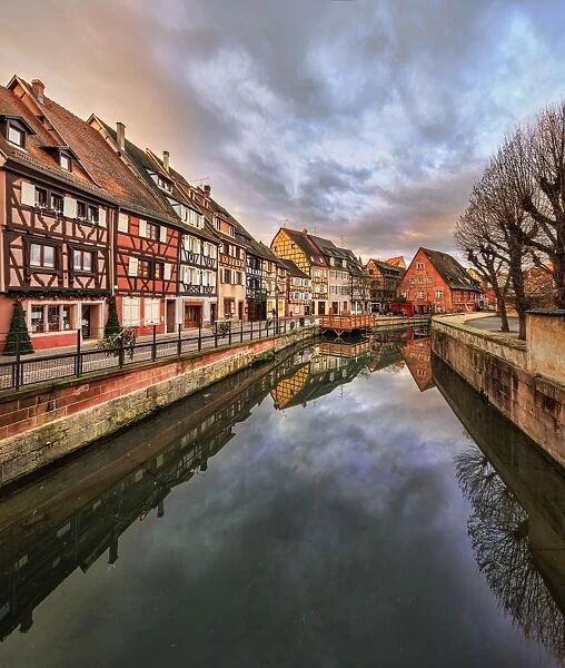 Panorama of colored houses reflected in River Lauch at sunset, Petite Venise, Colmar