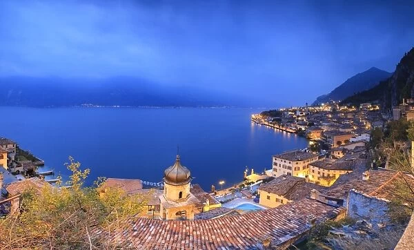 Panorama of Lake Garda and the typical town Limone Sul Garda at dusk, province of Brescia