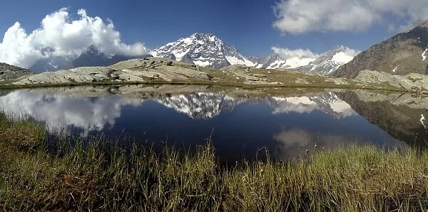 Panorama of Mount Disgrazia reflected in the lake Vazzeda, Alpe Fora, Malenco Valley