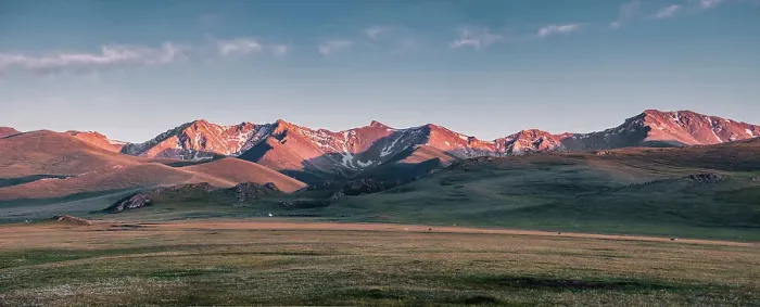 Framed Print : Panorama of sunset over snow-capped mountain range in the Song Kol lake area of Kyrgyzstan Framed Print : Panorama of sunset over snow-capped mountain range in the Song Kol lake area of Kyrgyzstan