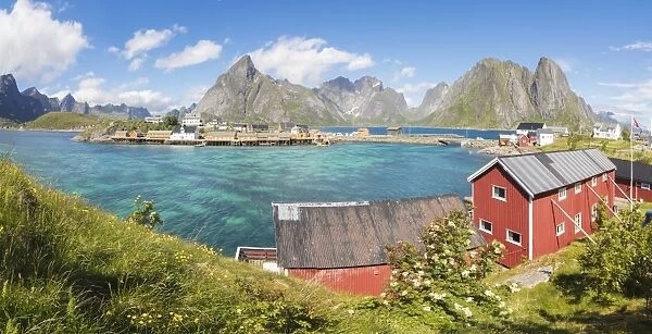 Panorama of turquoise sea and typical fishing village surrounded by rocky peaks, Sakrisoy