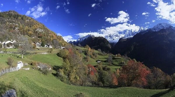 Panorama of the village of Soglio surrounded by colorful woods, Bregaglia Valley