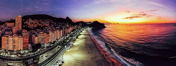 Panoramic aerial drone view of Leme Beach in the Copacabana district at sunrise with the iconic Sugarloaf Mountain in the background, UNESCO World Heritage Site, Rio de Janeiro, Brazil, South America