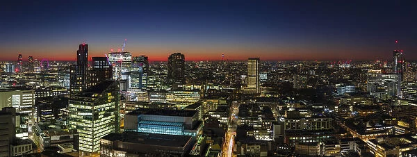 Panoramic aerial view of London skyline at dusk, including St. Pauls Cathedral and West London, England, United Kingdom, Europe