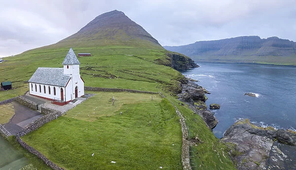 Panoramic of Church of Vidareidi by the sea, Vidoy Island, Faroe Islands, Denmark