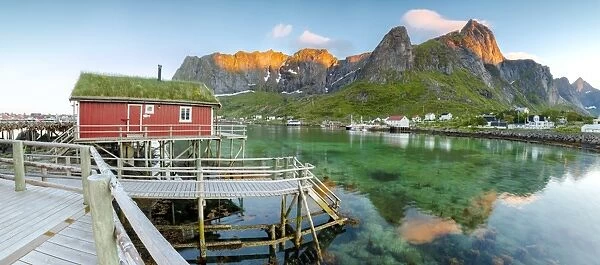 Panoramic of the fishing village surrounded by sea and midnight sun, Reine, Nordland county