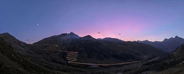 Panoramic of lights of car traces at sunset, Spluga Pass, Chiavenna Valley, Switzerland