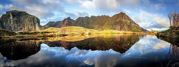 Panoramic of mountains reflected in the calm waters of a fjord at dawn, A i Lofoten, Moskenes, Lofoten Islands, Nordland, Norway, Scandinavia, Europe