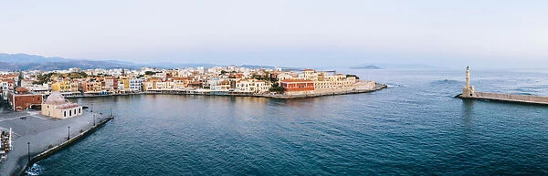 Panoramic of the old Venetian harbour and lighthouse of Chania at sunrise, aerial view