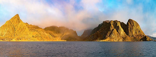 Panoramic of Olstind and Festhelltinden mountains in the mist at dawn, Reine, Lofoten Islands, Nordland, Norway, Scandinavia, Europe