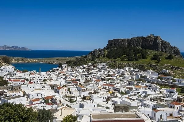 Panoramic view of beautiful Lindos village with its castle (Acropolis), Rhodes, Dodecanese Islands