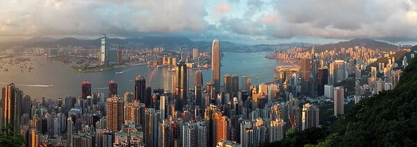Panoramic view with the illuminated skyline of Central below The Peak, seen from Victoria Peak
