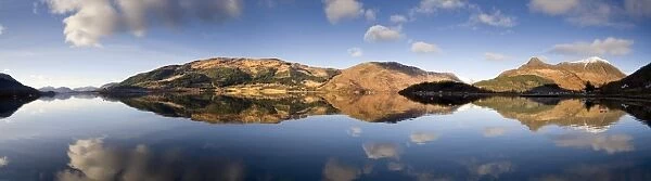 Panoramic view of Loch Levan in flat calm conditions with perfect reflections of distant mountains including Pap Of Glencoe, Glencoe Village, Highland, Scotland, United