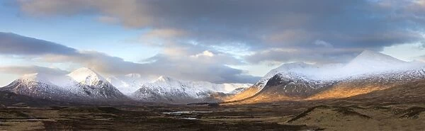 Panoramic view across Rannoch Moor on clear winter morning towards the snow-covered mountains of the Black Mount range, Rannoch Moor, near Fort William, Highland, Scotland, United
