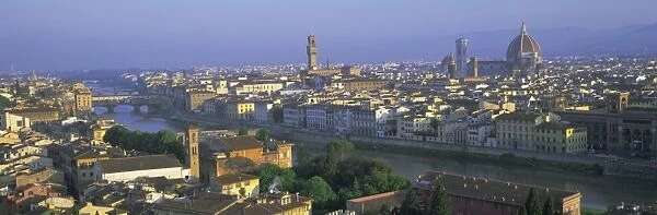 Panoramic view over rooftops and across Arno River