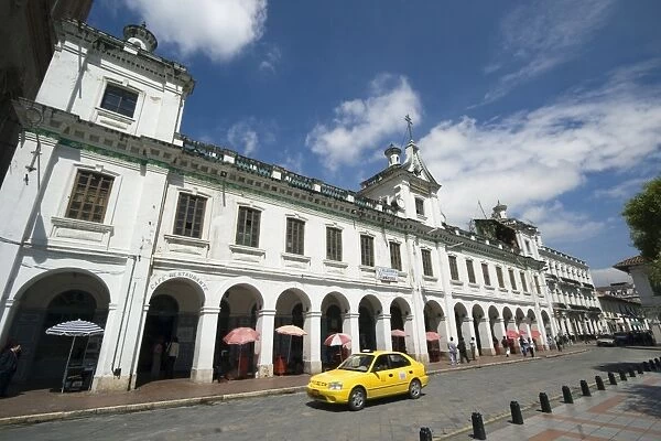 Parade of shops on Calle Bolivar at Parque Calderon, the main plaza in the centre of this attractive colonial capital, Cuenca, Azuay Province, Southern Highlands, Ecuador