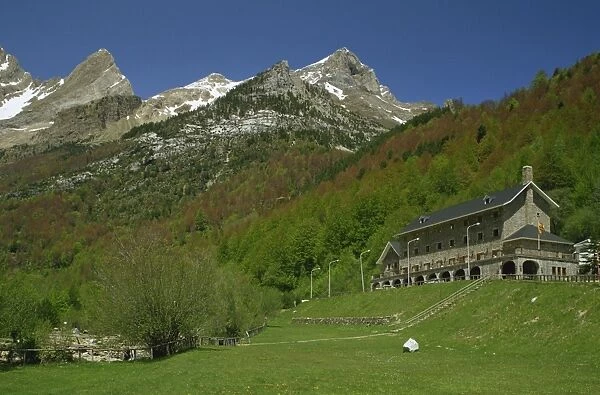 The Parador of Bielsa with snow capped mountains behind