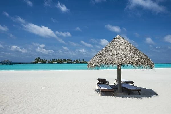 Parasol on a white sand beach and turquoise water, Sun Island Resort, Nalaguraidhoo island