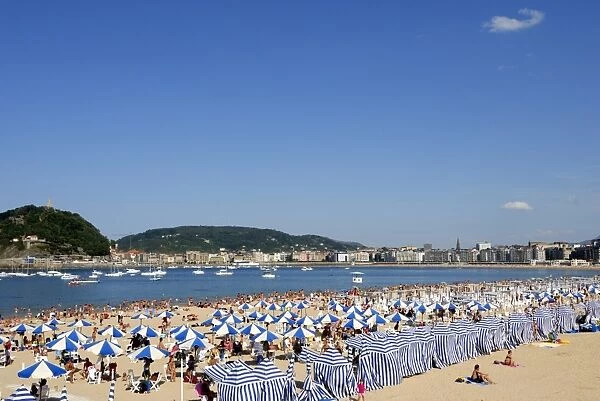 Parasols on the beach and town view, San Sebastian, Basque country, Euskadi