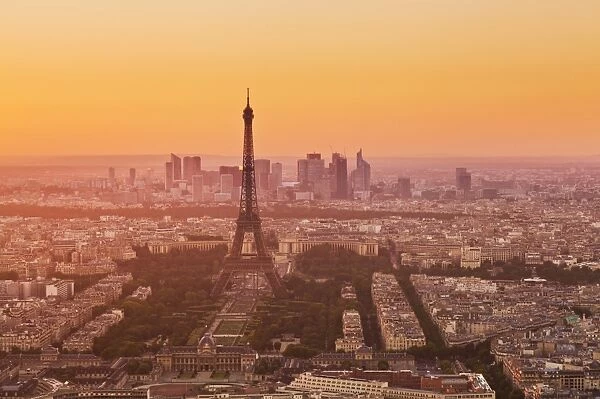 Paris skyline at sunset with the Eiffel Tower and La Defense, Paris, France, Europe