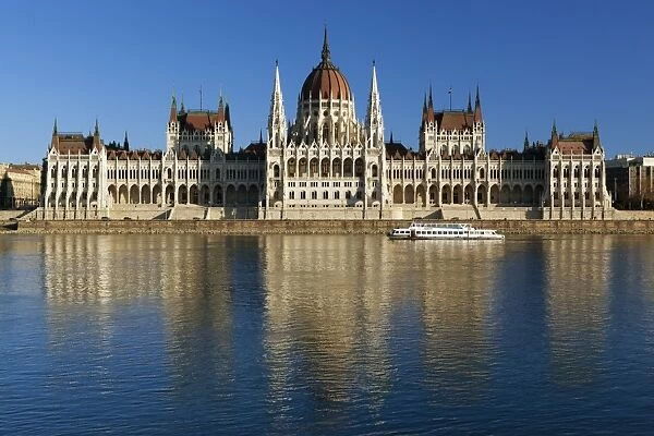 The Parliament (Orszaghaz) across River Danube at sunset, UNESCO World Heritage Site, Budapest, Hungary, Europe