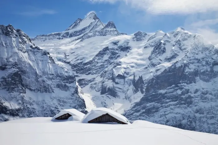 Framed Print : Partially buried buildings on the ski slopes in front of the Schreckhorn mountain Framed Print : Partially buried buildings on the ski slopes in front of the Schreckhorn mountain