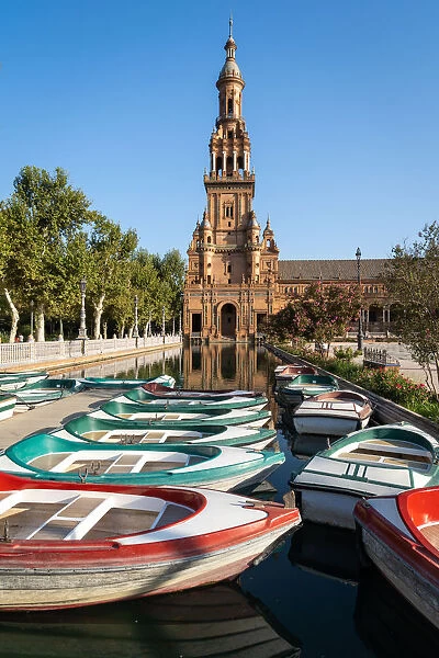 Passenger boats in front of the North Tower of Plaza de Espana, Parque de Maria Luisa