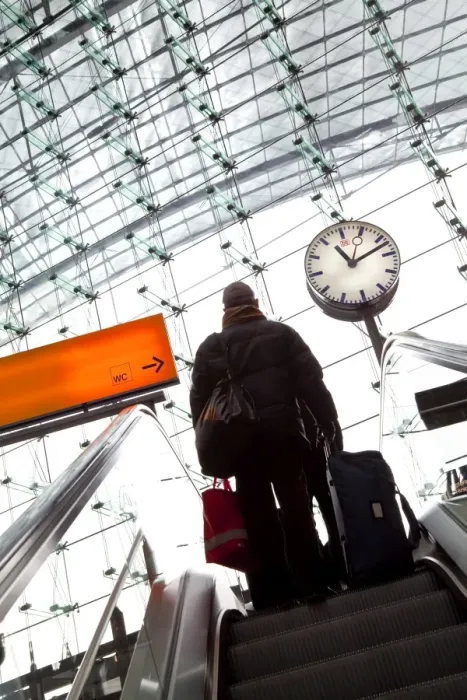 Framed Print : Passenger on escalator and platform clock at modern train station, Berlin Framed Print : Passenger on escalator and platform clock at modern train station, Berlin