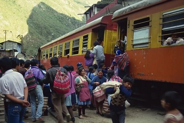 Passengers leaving and boarding the train at the railway