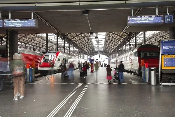 Passengers rushing through Lucerne railway station, Lucerne, Switzerland, Europe