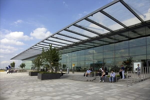 Passengers wait outside Terminal 4, Heathrow Airport, London, England, United Kingdom
