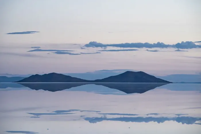 Framed Print : Pastel-coloured beauty of salt flats reflecting the clouds and mountains after rainfall Framed Print : Pastel-coloured beauty of salt flats reflecting the clouds and mountains after rainfall