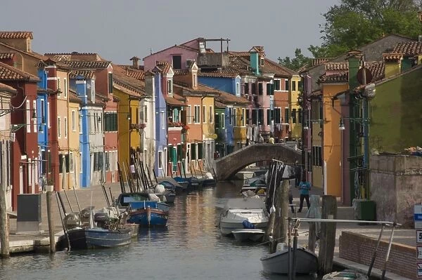 Pastel coloured houses alongside a canal in Burano, Venetian Lagoon, Venice