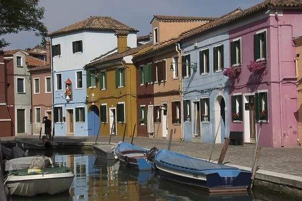 Pastel coloured houses by a canal in Burano, Venetian Lagoon, Venice, Veneto