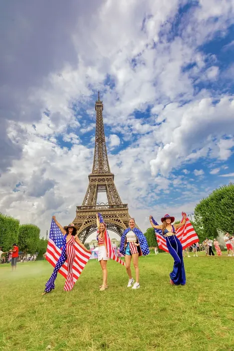 Framed Print : Patriotic American Woman jumping and cheering for Team USA and the Paris 2024 Olympics in front of the Eiffel Tower beach volleyball stadium, Paris, France, Europe Framed Print : Patriotic American Woman jumping and cheering for Team USA and the Paris 2024 Olympics in front of the Eiffel Tower beach volleyball stadium, Paris, France, Europe