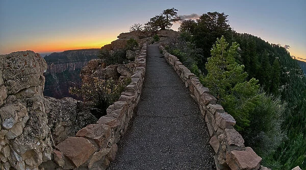 The paved pathway between Bright Angel Point and the visitor center at Grand Canyon North Rim at twilight, Grand Canyon National Park, UNESCO World Heritage Site, Arizona, United States of America, North America