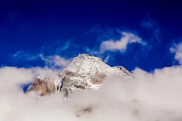 Peak of Mount Everest peeking through the clouds, Sagarmartha National Park, UNESCO